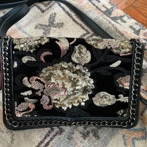 Women cross body/shoulder bag black with sequence floral design.Adjustable strap